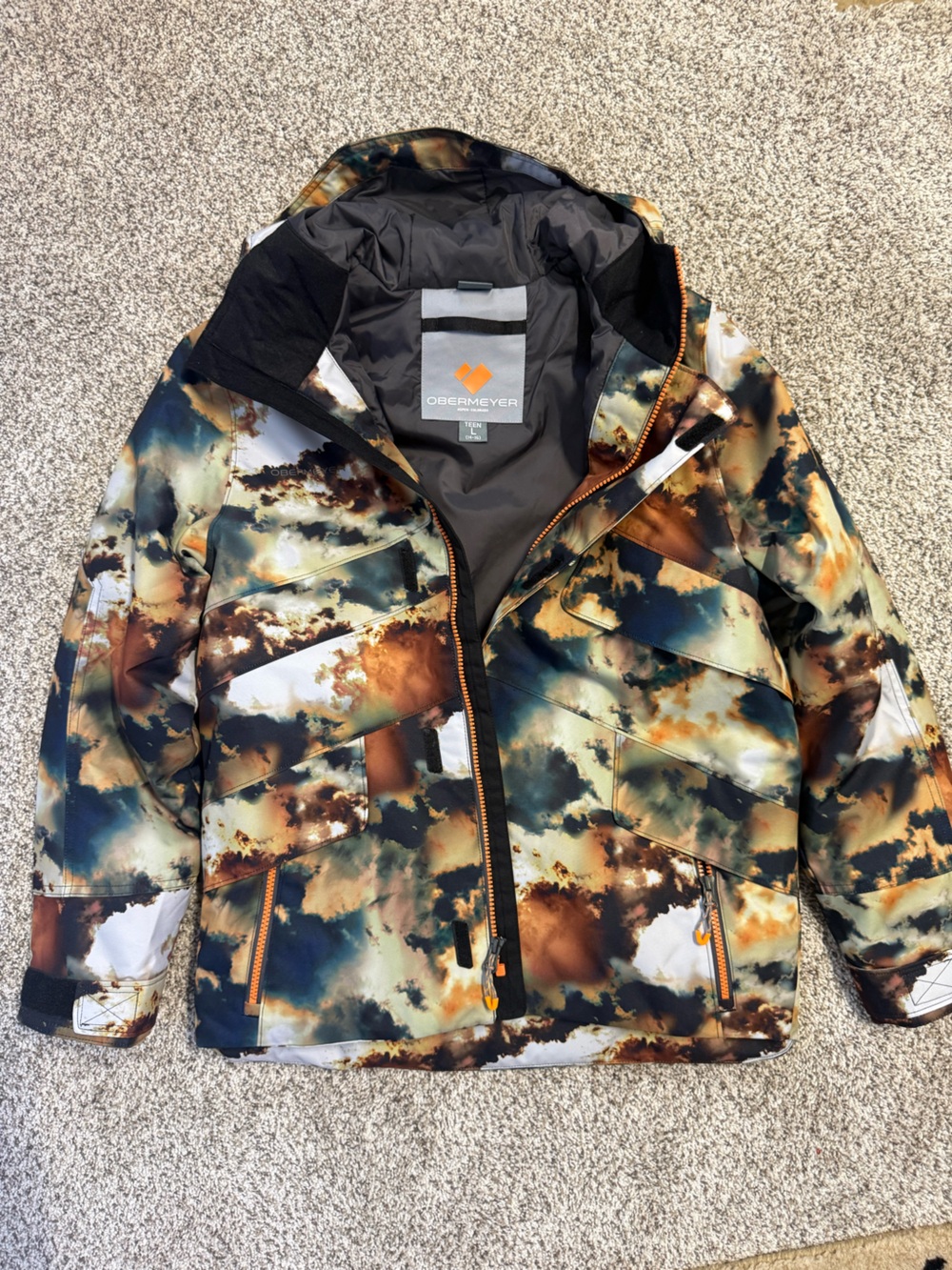 NWOT Obermeyer boys winter Jacket in Blue, Brown, Tan, Cream & Black Cloud Print